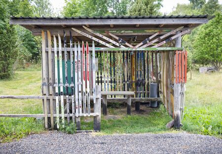 HIIUMAA, ESTONIA - JULY 29, 2018: Resting cabin decorated with old skies in Hiiumaa, Estonia in July 2018のeditorial素材