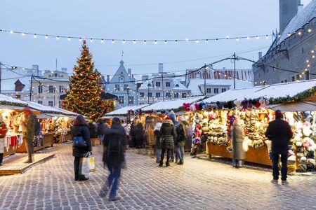 TALLINN, ESTONIA - DECEMBER 22, 2018: People visit christmas market in the old town of Tallinn, capital of Estonia on December 22, 2018のeditorial素材
