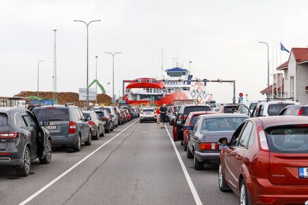 HIIUMAA, ESTNOIA - JULY 29, 2018: Vehicles in long barge queue in Heltermaa port in Hiiumaa, Estonia in July 2018のeditorial素材
