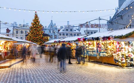 TALLINN, ESTONIA - DECEMBER 22, 2018: People visit christmas market in the old town of Tallinn, capital of Estonia on December 22, 2018のeditorial素材