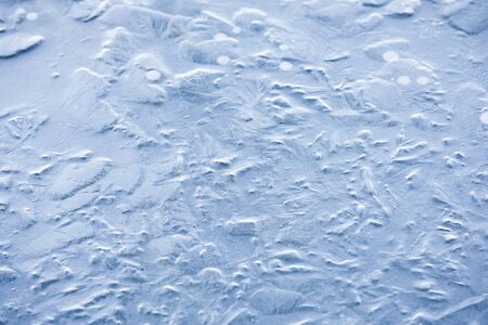 Abstract background of naturally textured frozen water surfaceの写真素材