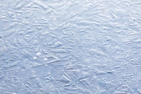 Abstract background of naturally textured frozen water surfaceの写真素材