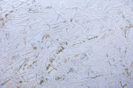 Abstract background of naturally textured frozen water surfaceの写真素材