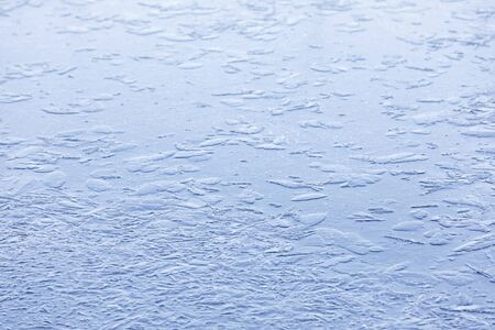 Abstract background of naturally textured frozen water surfaceの写真素材