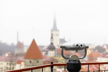 Closeup of a silver colored viewing machine at viewpoint in the old town of Tallinn, Estoniaの写真素材