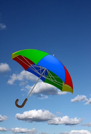 Colorful umbrella flying in the skyの写真素材