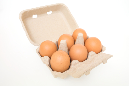 Eggs in egg carton isolated on white の写真素材