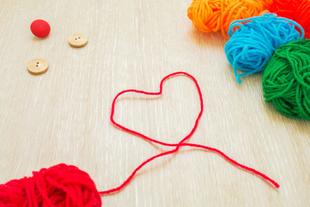 Red thread with heart shapeの写真素材