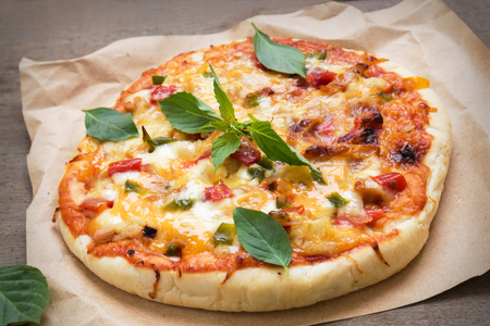 Pizza with tomato sauce and basilの写真素材