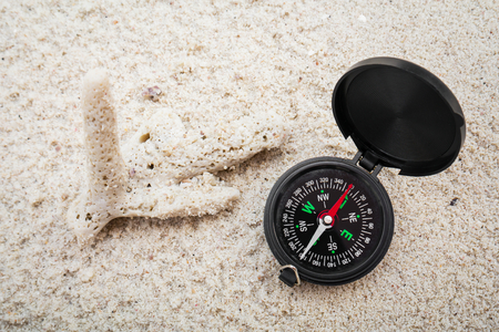 Compass on the sandの写真素材