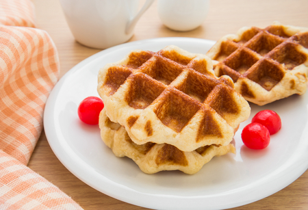 Waffles with cherries on plateの写真素材