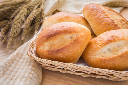 Baguette or bread in wicker basketの写真素材