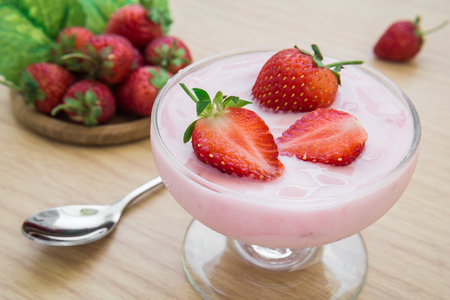 Yogurt with strawberry in glassの写真素材