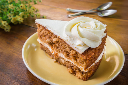 Slice of carrot cake on plateの写真素材