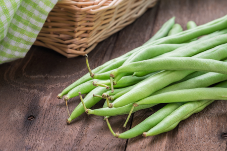 Green beans on wooden table