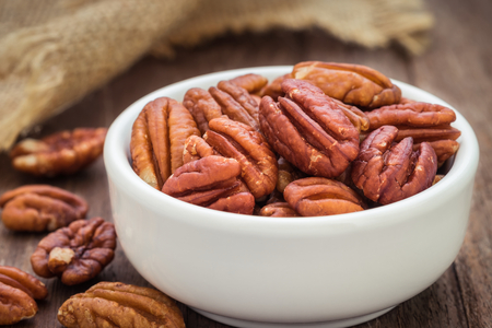 Pecan nuts in white bowlの写真素材