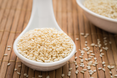 Sesame seeds on spoonの写真素材