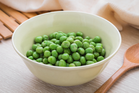 Green peas in bowlの写真素材