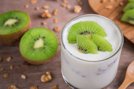 Yogurt with kiwi in glassの写真素材
