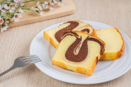 Butter cake sliced on plateの写真素材
