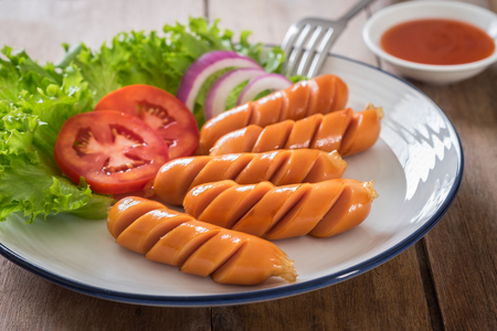 Fried sausages on plate and dip sauceの写真素材