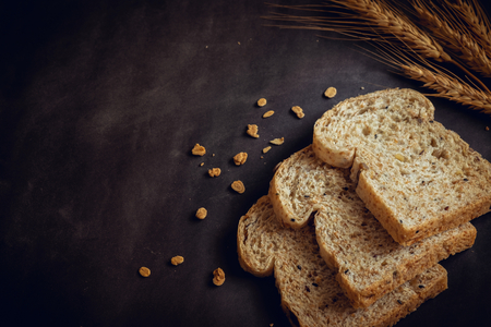 Whole grain bread on dark background