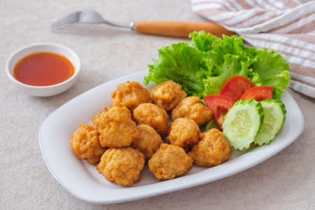 Deep fried shrimp ball and vegetable on plateの写真素材