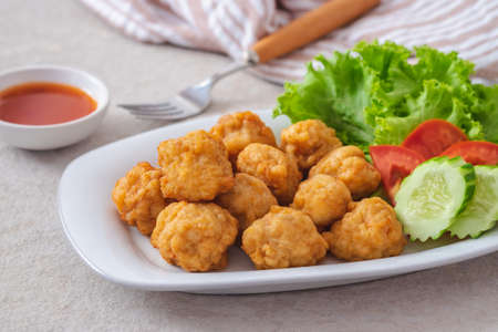 Deep fried shrimp ball and vegetable on plateの写真素材