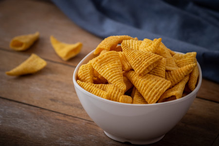Crunchy corn snack in white bowlの写真素材
