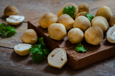 Straw mushroom on wooden tableの写真素材