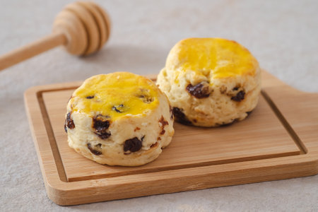 Raisin scones on wooden boardの写真素材