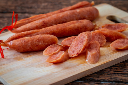Chinese sausage on wooden cutting boardの写真素材