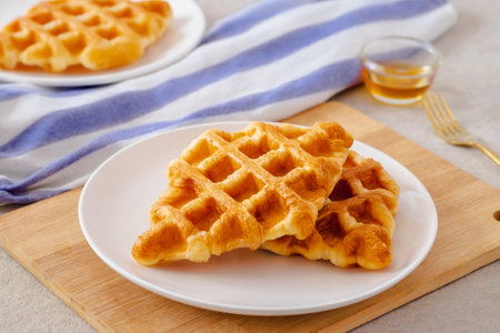 Croffle or croissant waffle on white plateの写真素材