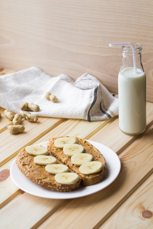 Toasts with banana and peanut butterの写真素材