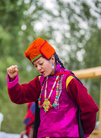 Artists in traditional tibetan costumes performing folk song  in Leh, India.のeditorial素材