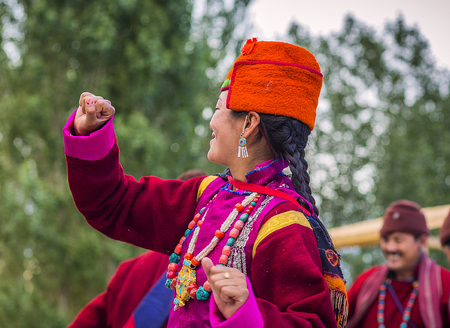 Artists in traditional tibetan costumes performing folk song  in Leh, India.のeditorial素材