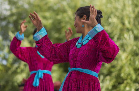 Artists in traditional tibetan costumes performing folk song  in Leh, India.のeditorial素材