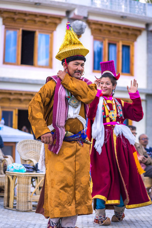 Artists in traditional tibetan costumes performing folk song  in Leh, India.のeditorial素材
