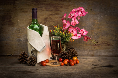 Still life with a flower and  fruit wineの写真素材
