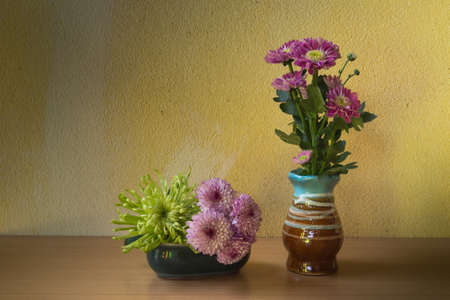 Still life with flower on wooden table and grunge backgroundの写真素材