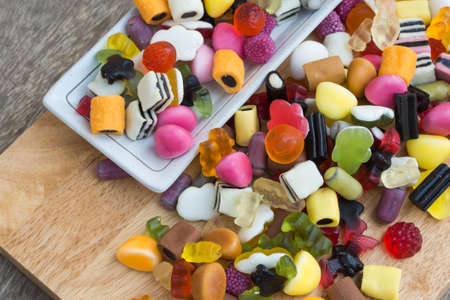 Mix jelly fruits  on wooden background