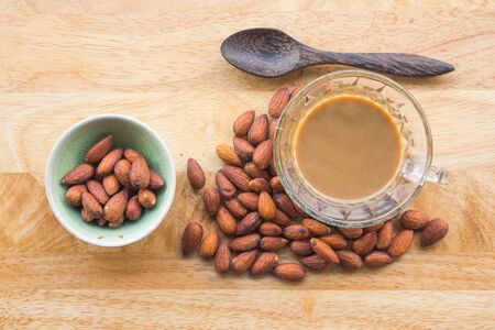 Almonds and hot coffee for healthyの写真素材