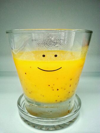 Mix smoothie in a smiley glassの素材