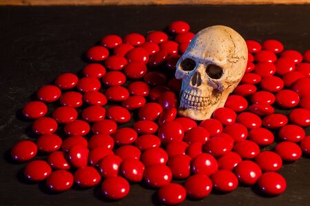 still life with skull and  red medicine on abstract backgroundの写真素材