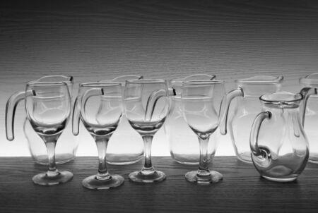 still life with glassware collection on wooden backgroundの写真素材