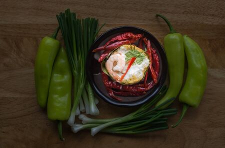 Steamed fish and shrimp with curry,  ,focus and light on plateの写真素材