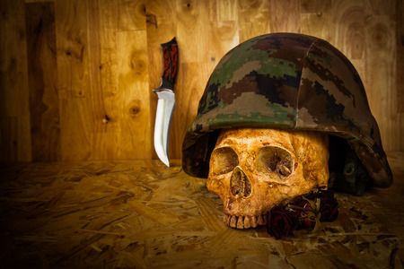 Still life with human skull in soldier helmetの写真素材