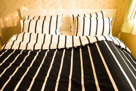 Still life with pillow and bed  in bedroomの写真素材