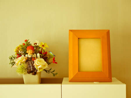 Wooden frame and flowers on vintage background,Still lifeの写真素材