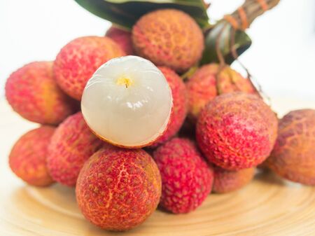 Fresh and sweet organic lychee on wooden backgroundの写真素材
